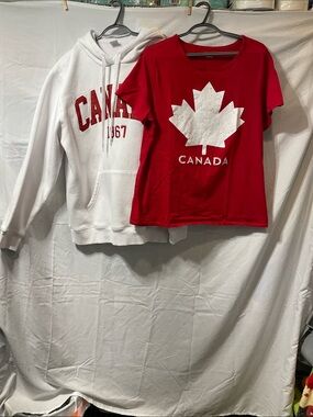 1 Mens White Canada Hoodie Size L.  1 Ladies Red Canada T-Shirt Size 1x.